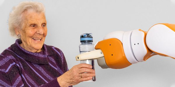 Robot Lio handles the water to an elderly woman